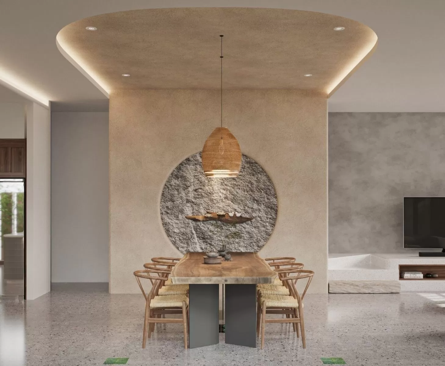 Phong cách nội thất tối giản thể hiện ở chiếc bàn nguyên khối và mảng tường đá sần choán toàn bộ không gian phòng ăn