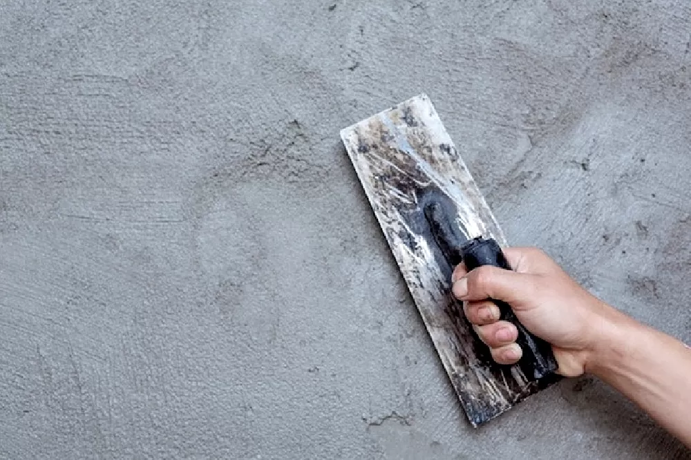 Lượng xi măng trát 1m2 tường là 12,8kg