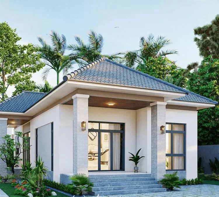 Mẫu nhà cấp 4 mái Nhật 2 phòng ngủ hiện đại với các trụ lớn và cửa kính làm điểm nhấn.