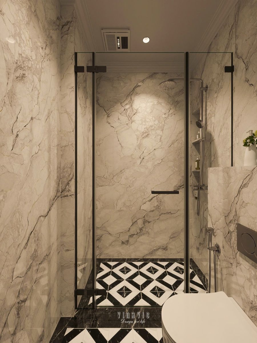 Phòng tắm sử dụng đá vân sáng, tạo cảm giác rộng thoáng và thanh lịch